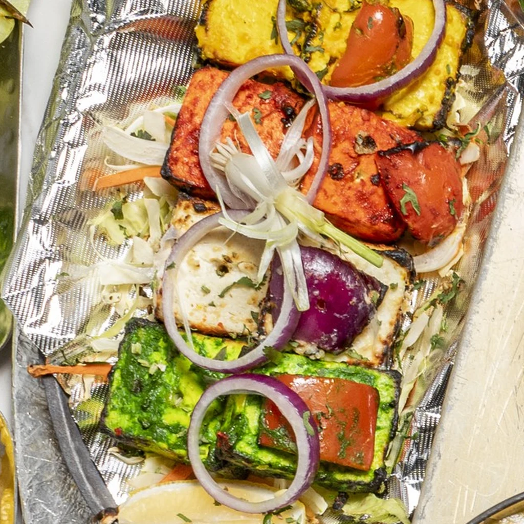 Tandoor-grilled paneer tikka with peppers, tomatoes and onions at Raja Chettinad