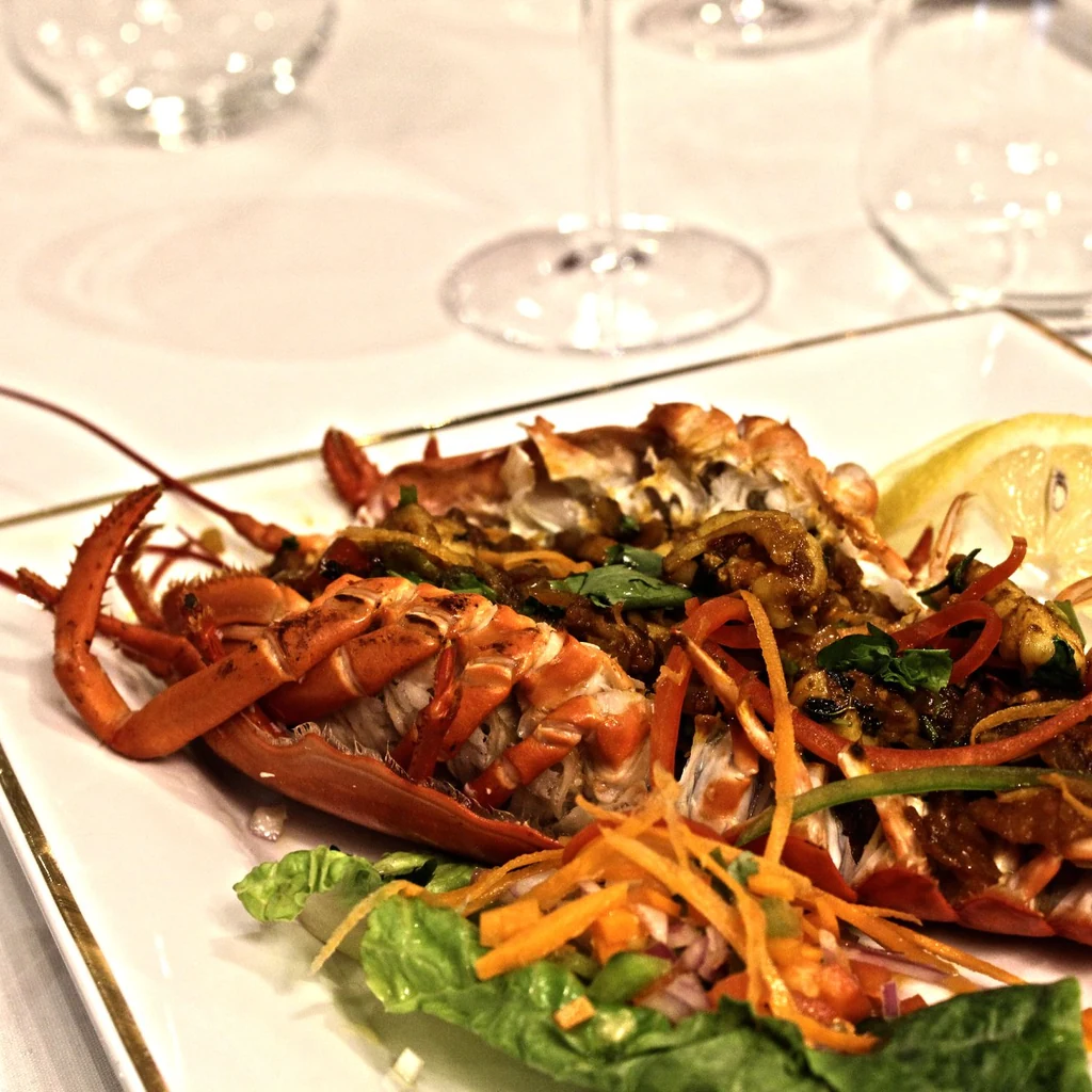 Tandoori lobster served with lemon and salad at Raja Chettinad Kitchener